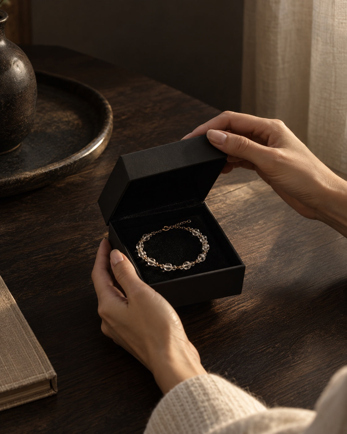 A customer opening a crystal bracelet at home